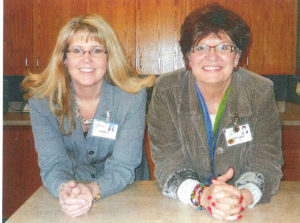Comprehensive Case Management Director, Marla Maxey (left), smiles with Debbie Lapp (right) at Foothills Gateway.